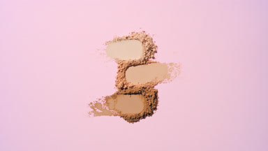 Aligned Skin Tone Powder Streaks on Rosy Pink Background
