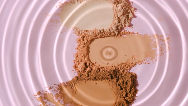 Slow Motion of Water Droplet on Powder Piles