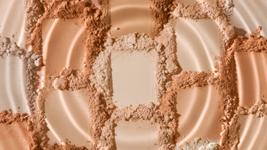 Macro Shot of Droplet Creating Ripples on Beige Powder