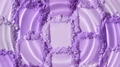 Macro Shot of Droplet on Violet Powder Piles