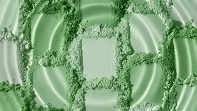 High-Magnification Shot of Droplet on Green Powder Streaks