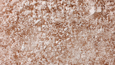Light Beige Powder Surface Exploding in Slow Motion