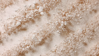 Cracked Beige Powder Surface Shattering from Below
