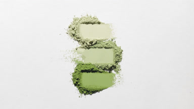 Top View of Pale Green Powder Piles with Vivid Shadows