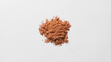 Macro Close-Up of Beige Powder on Gray Backdrop