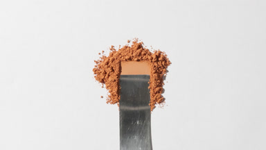 Beige Loose Powder Smoothing on Light Grey Background