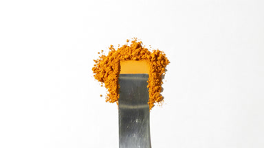 Yellow Loose Powder Scraped on Light Gray Background