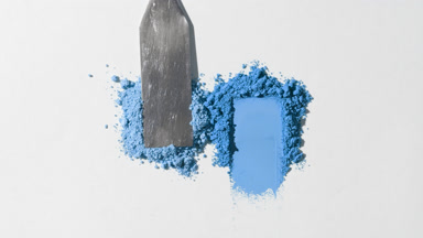 Blue Powder Heaps on Soft Gray Backdrop