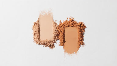 Beige and Orange Powder Smears on Faint Grey Backdrop