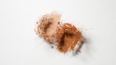 Beige and Orange Powder Burst for Bronzer Ad