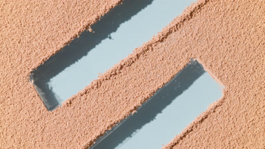 Dynamic Shadows on Beige Powder with Blue Background