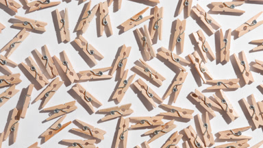 Clothespins on White Backdrop with Changing Shadows