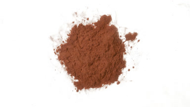 Brown Dust Torrent in Petri Dish on White Background