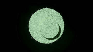 Green Powder with Dynamic Shadows on Black Backdrop
