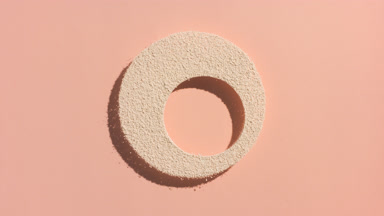 Fluid Shadows of Beige Powder on Beige Tone Surface