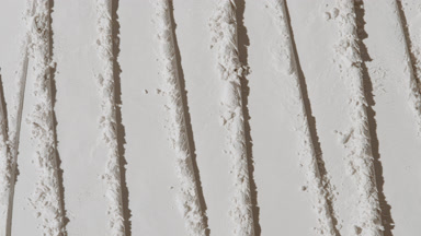 Overhead Shot of White Powder with Knife Patterns and Light