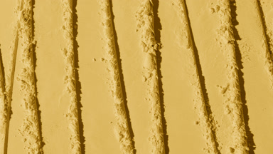 Overhead Shot of Yellow Powder Surface with Knife Trails