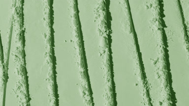 Top Angle View of Pale Green Powder Surface with Shadows