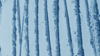 Arc Shot of Pale Blue Powder Surface with Shifting Shadows