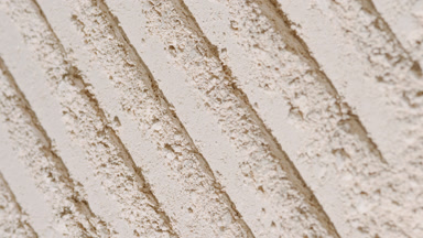 Beige Powder Surface with Repeated Knife Trail Patterns