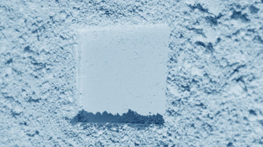 Flowing Shadows on Pale Blue Powder Surface