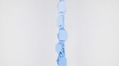 Blue Powder Smears on Dim Grey Background with Shadows