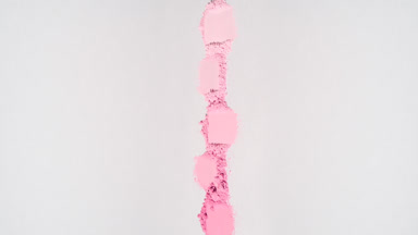 Pink Powder Streaks on Light Grey Backdrop with Shadows