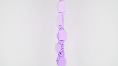 Violet Powder Smudges on Light Grey Backdrop