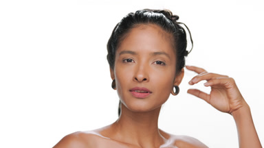 Latina with tan skin focuses on balanced skin in skincare ad