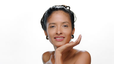South american woman warm skin tone rests chin on palm firm skin