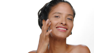 Argentine woman caramel skin taps cheek with finger elasticity