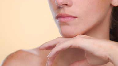 Fair-skinned brunette latina with freckles highlights fresh skin