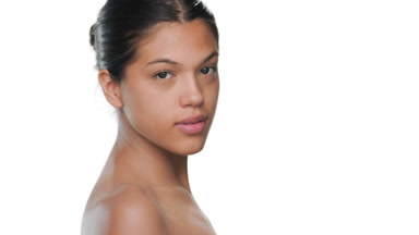 Confident beauty turns walks away showcasing soft skin