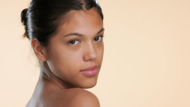 Skincare model looks over shoulder turns walks away