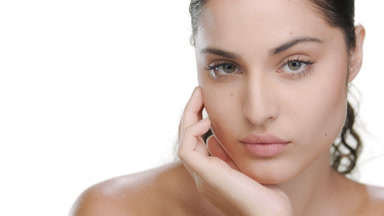 Fair-skinned Latina props chin, turns face, nourished skin