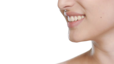 Hispanic beauty model smiles, looking aside, smooth skin