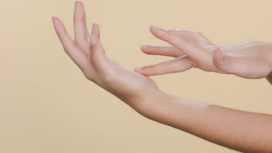 Fair-skinned female hands caress each other, soft hands