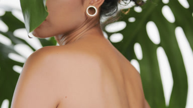 Beautiful latina turning body out of the camera showing her back